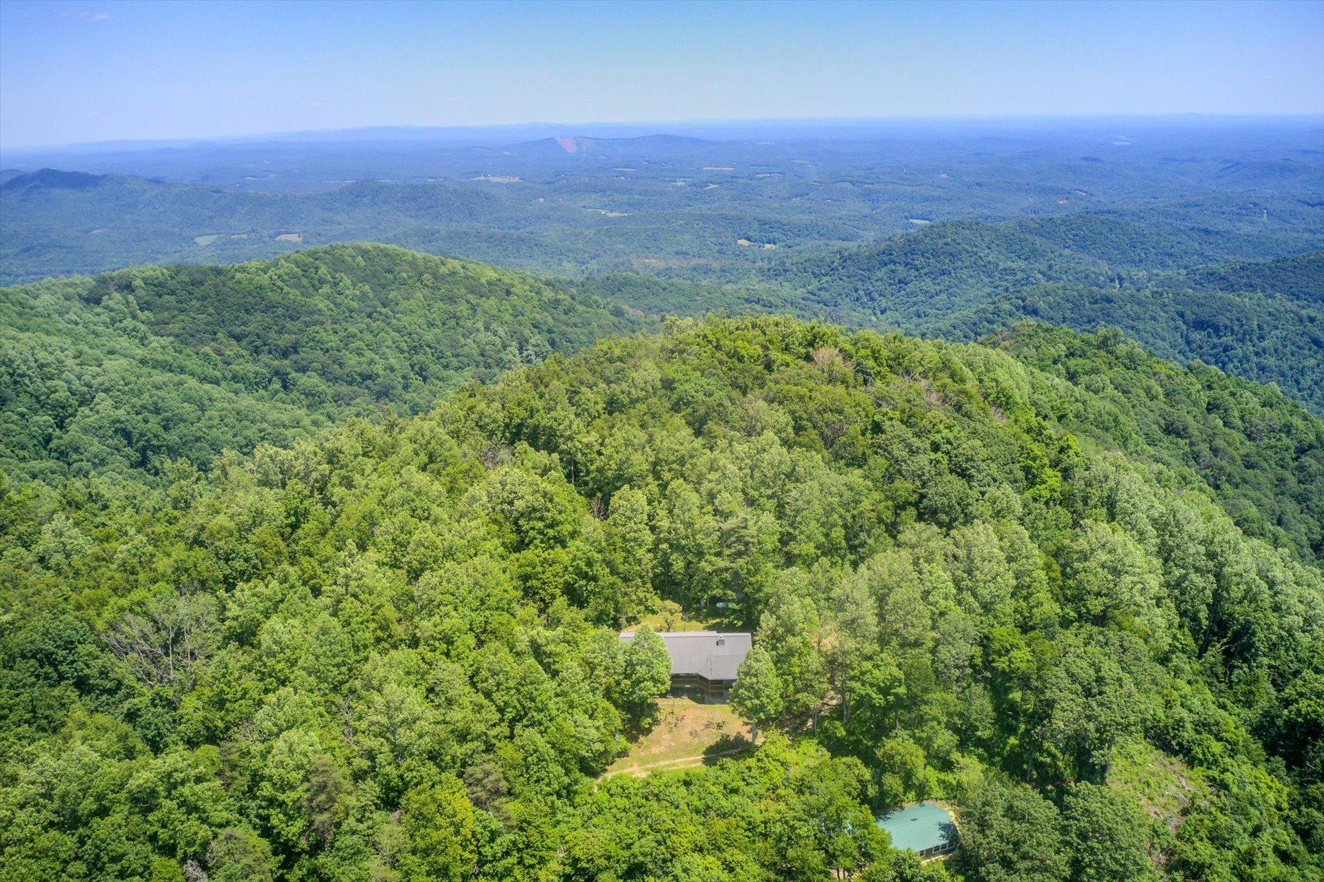 2005 Walnut Knob Road Southeast Floyd, VA 24091 - Photo 4 of 71 an aerial view of residential houses with outdoor space and trees