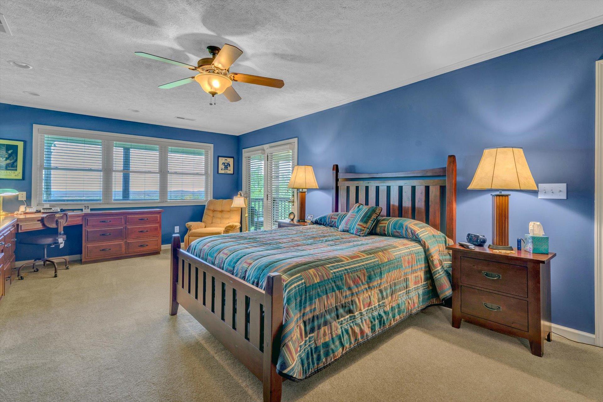2005 Walnut Knob Road Southeast Floyd, VA 24091 - Photo 33 of 71 a bedroom with a bed and a chandelier