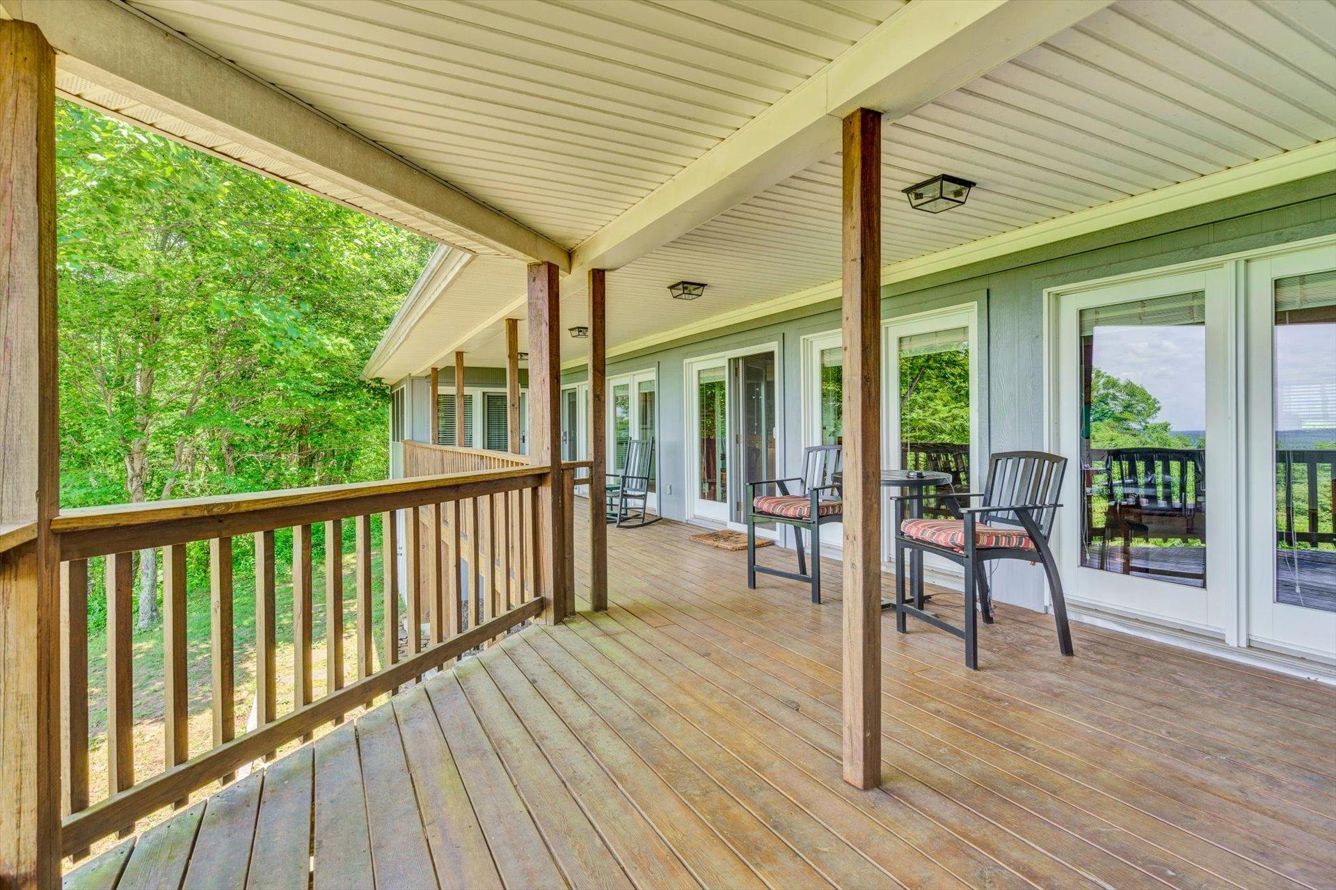 2005 Walnut Knob Road Southeast Floyd, VA 24091 - Photo 43 of 71 a porch with wooden floor table and chairs