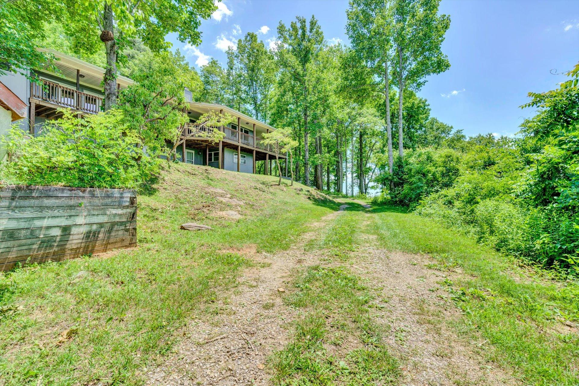 2005 Walnut Knob Road Southeast Floyd, VA 24091 - Photo 66 of 71 a backyard of a house with lots of green space and fountain