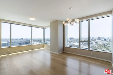 a view of room with window and hardwood