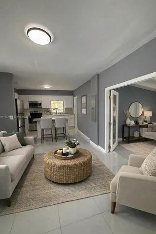 a living room with furniture and a lamp