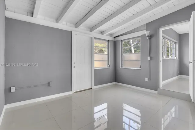 a view of a backyard with a tree