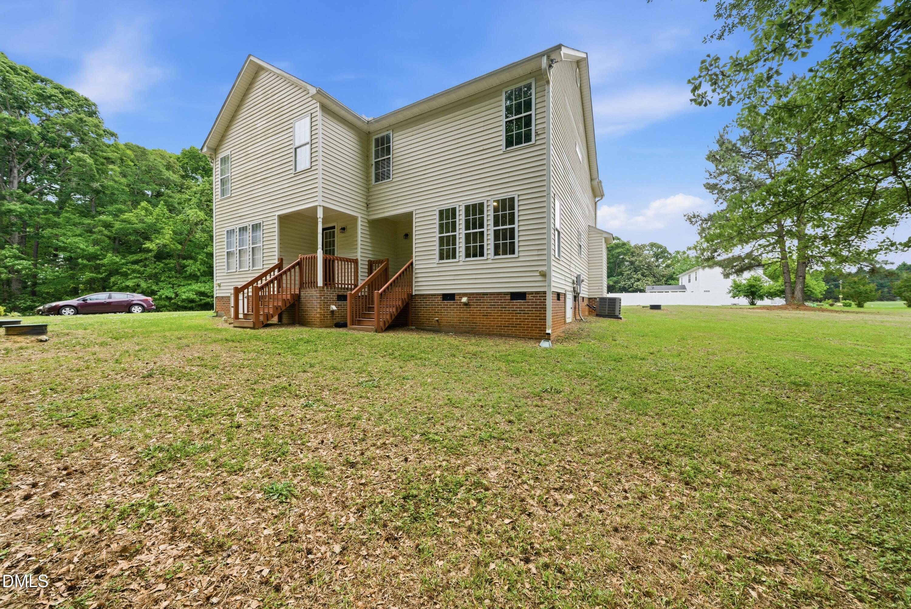 201 Tonylee Court, Unit A Raleigh, NC 27603 - Photo 5 of 30 a view of a house with backyard and sitting area