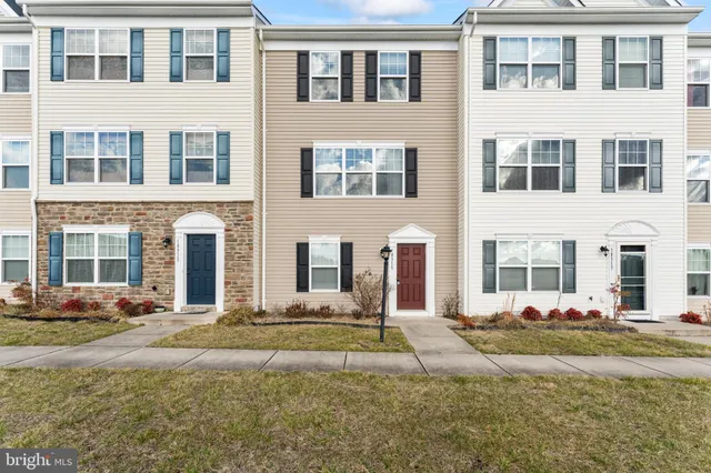 a front view of a building with lot of windows