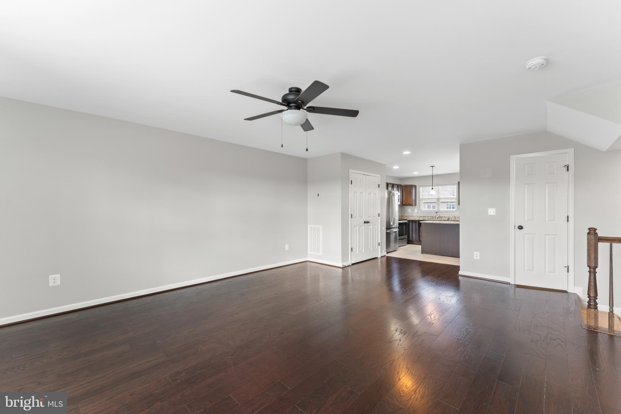 18315 Congressional Circle Ruther Glen, VA 22546 - Photo 12 of 37 an empty space with wooden floor and a ceiling fan