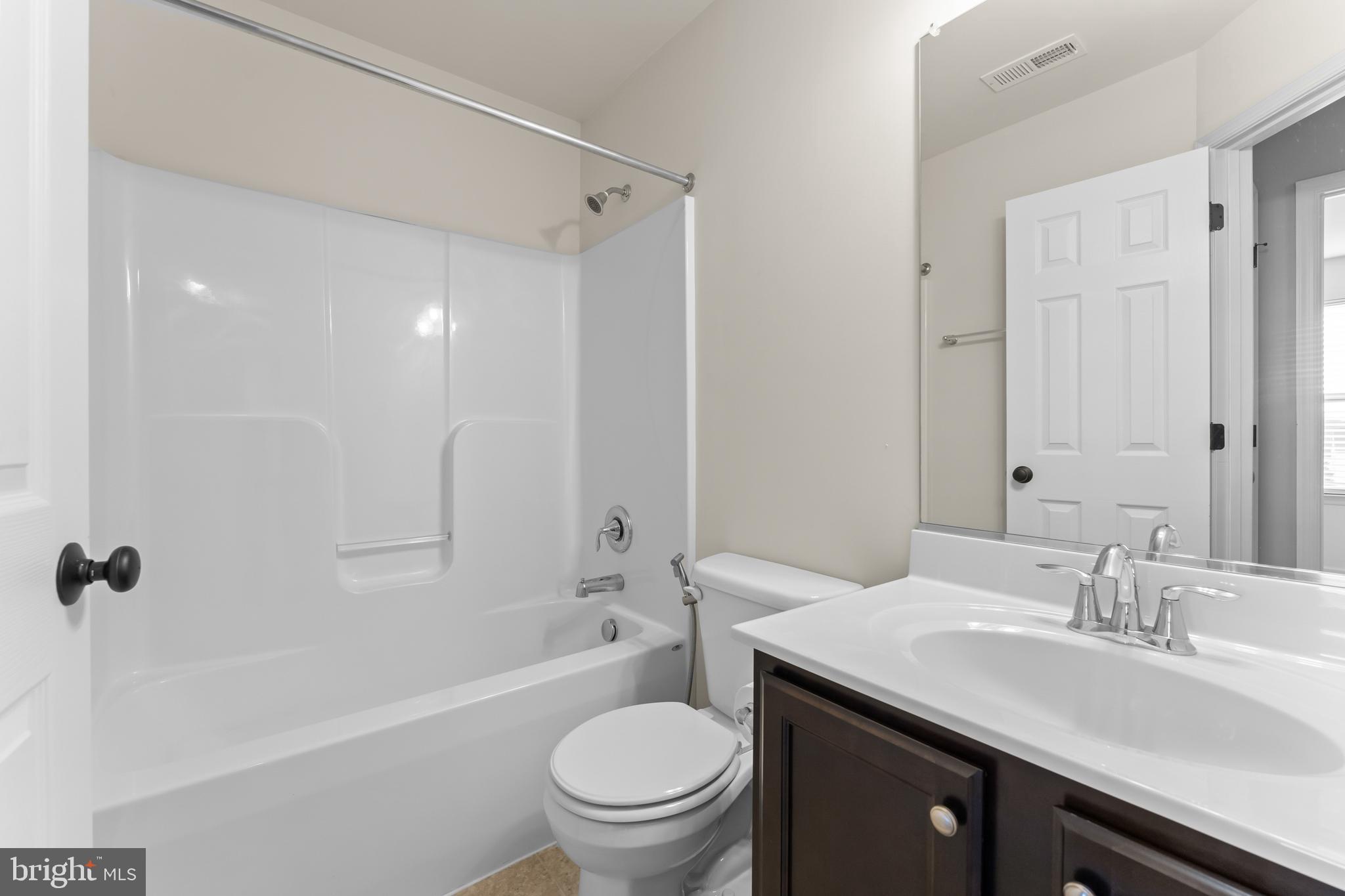 18315 Congressional Circle Ruther Glen, VA 22546 - Photo 26 of 37 a bathroom with a sink a toilet and shower