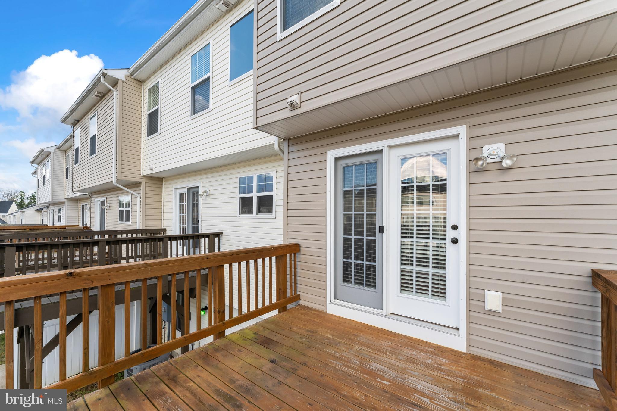 18315 Congressional Circle Ruther Glen, VA 22546 - Photo 31 of 37 a view of a house with wooden deck