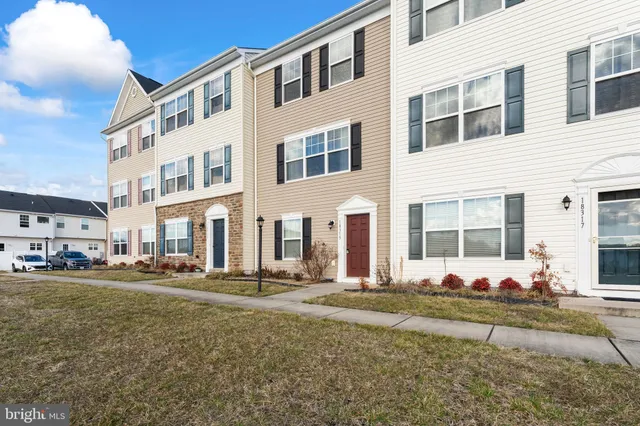 a front view of residential houses with street