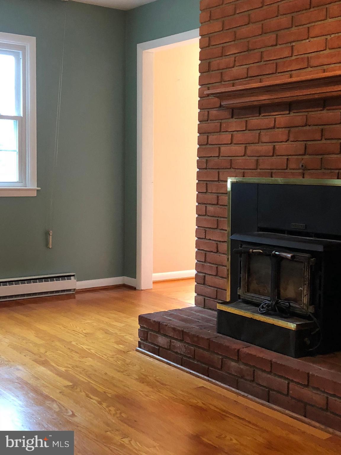10628 Old Frederick Road Thurmont, MD 21788 - Photo 5 of 45 Family room with wood stove.