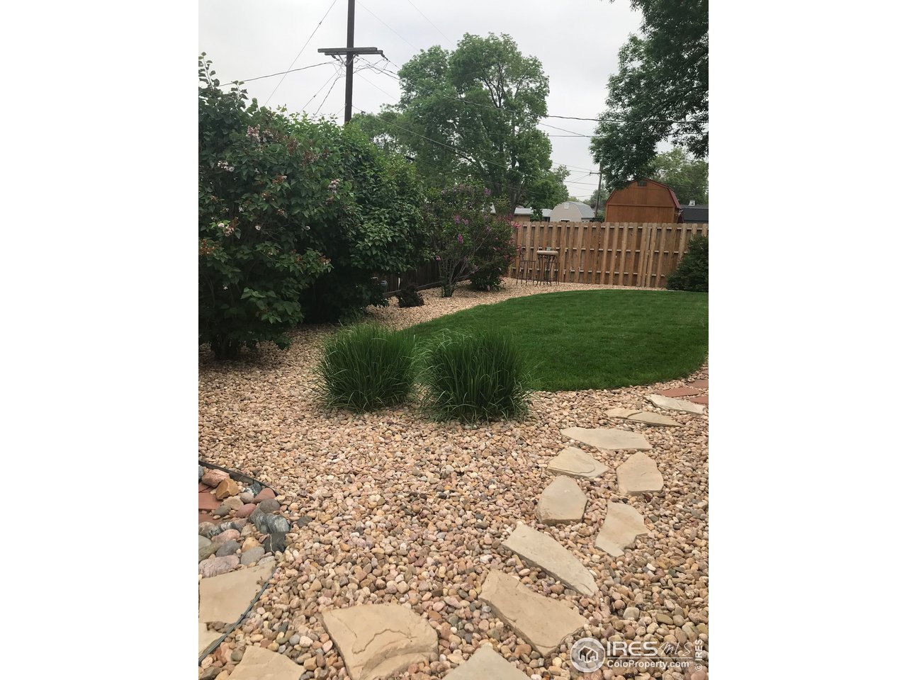 2127 14th Street Road Greeley, CO 80631 - Photo 11 of 36 Backyard with rock walkway