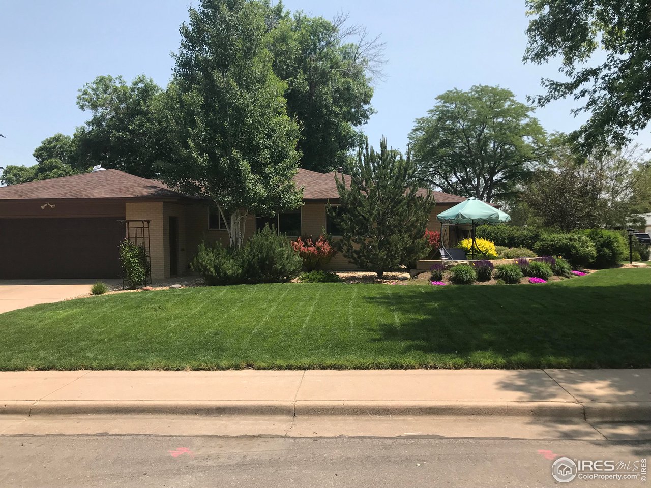 2127 14th Street Road Greeley, CO 80631 - Photo 6 of 36 Side yard with garage