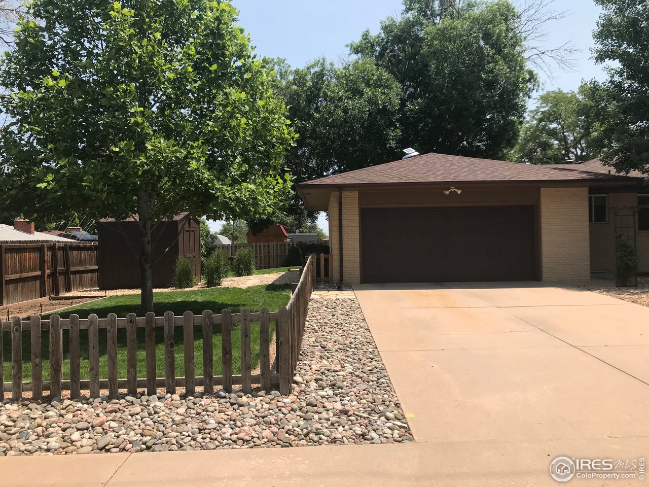 2127 14th Street Road Greeley, CO 80631 - Photo 7 of 36 Garage and backyard view with shed