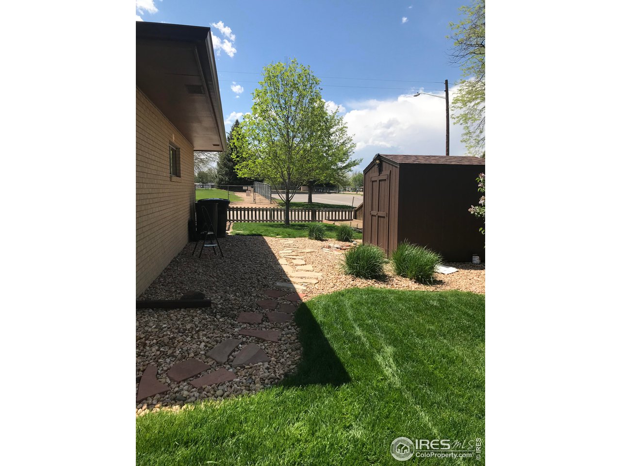 2127 14th Street Road Greeley, CO 80631 - Photo 8 of 36 Backyard walkway to front