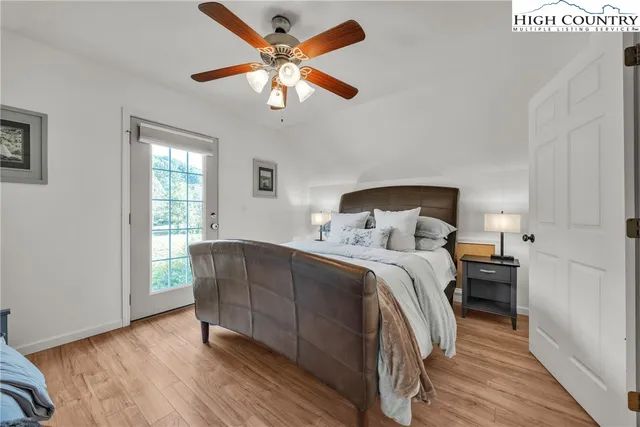 a bedroom with a bed and a lamp