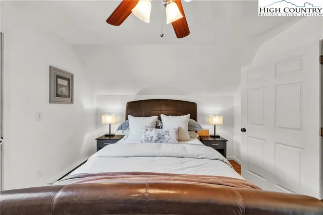 a bedroom with a bed and walk in closet