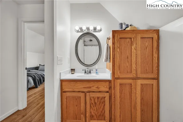 a white toilet sitting next to a window