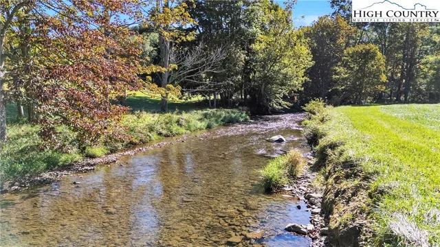 a view of a large body of water with a mountain