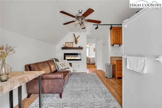 a living room with furniture and a clock
