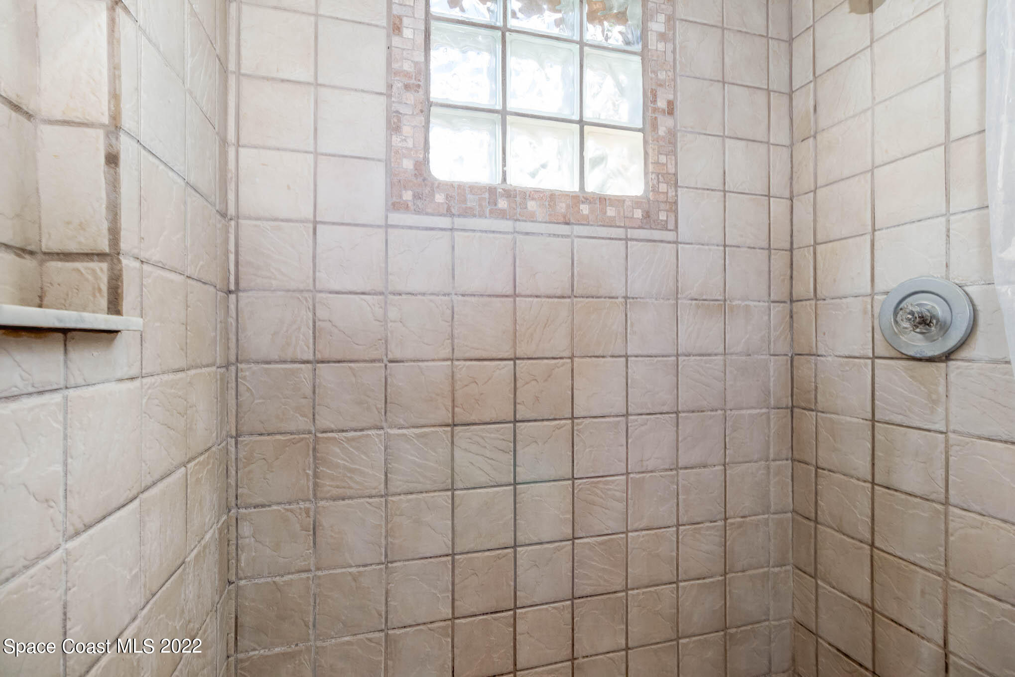 2539 Fulton Court Melbourne, FL 32935 - Photo 12 of 19 a bathroom with a shower