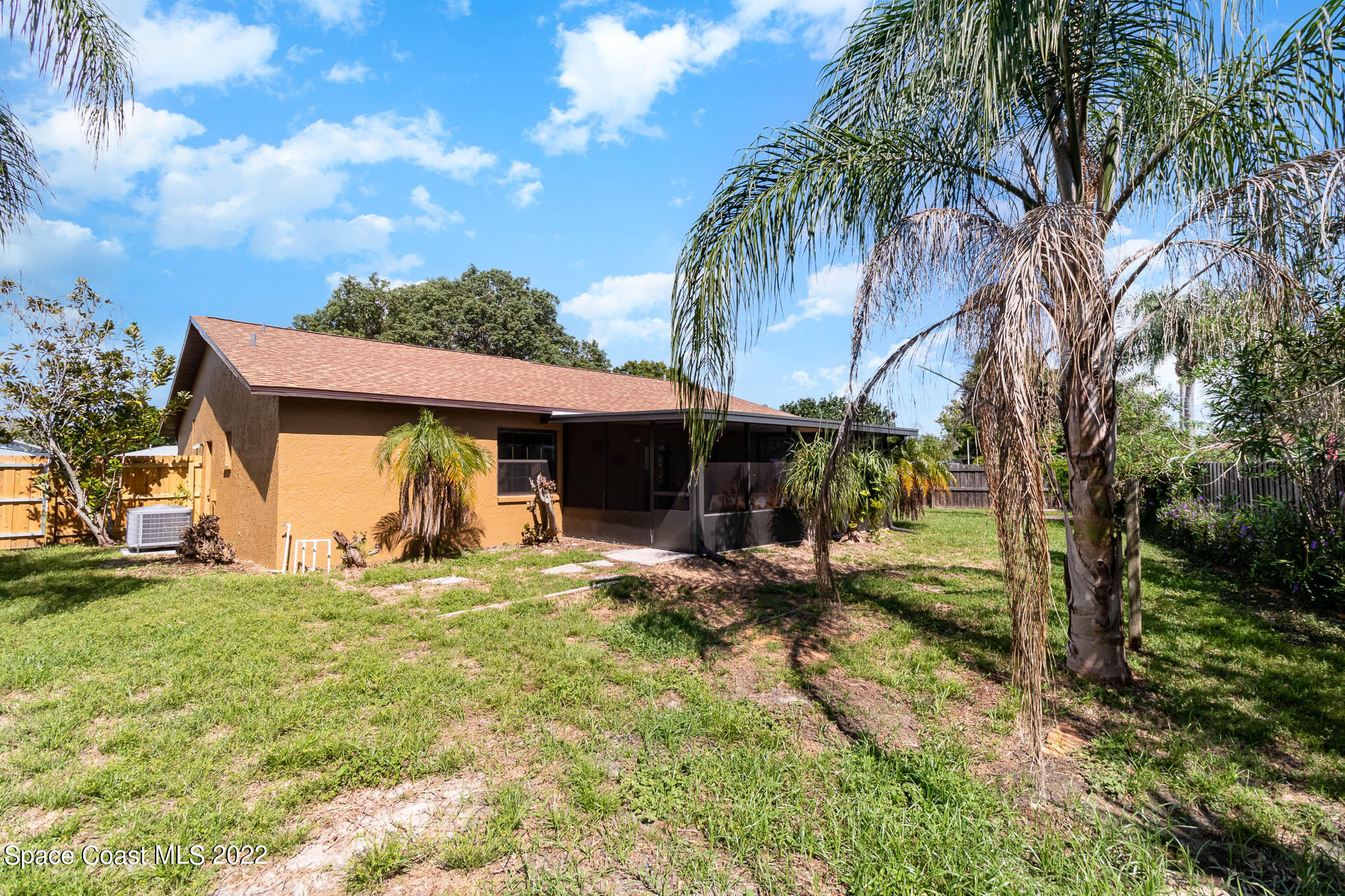 2539 Fulton Court Melbourne, FL 32935 - Photo 19 of 19 a view of a house with a yard