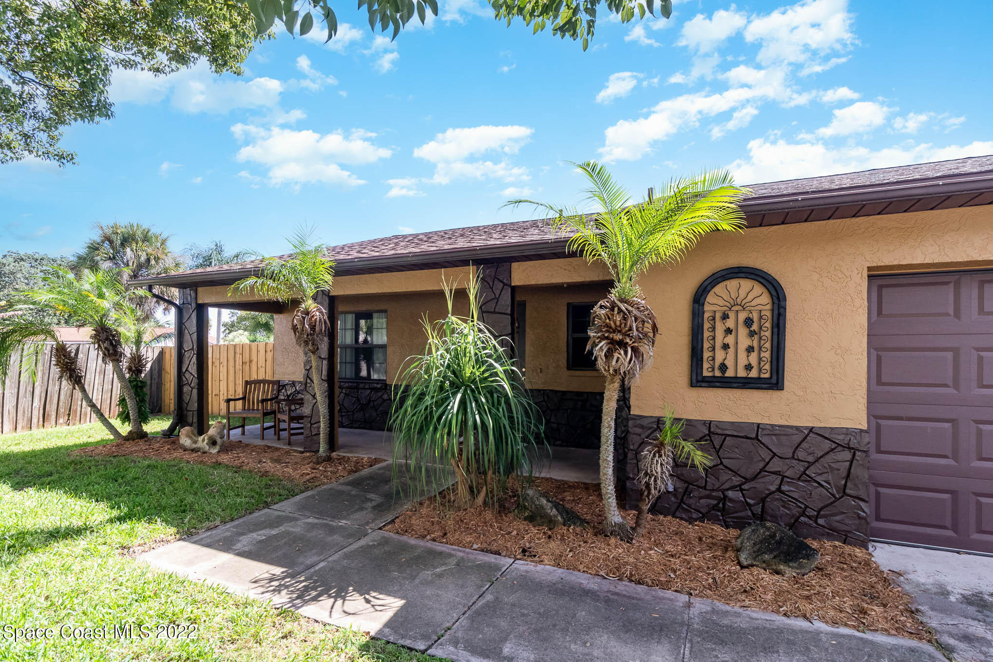 2539 Fulton Court Melbourne, FL 32935 - Photo 2 of 19 a front view of a house with garden