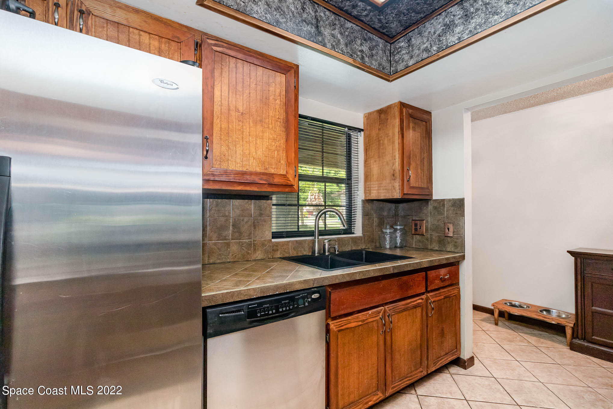 2539 Fulton Court Melbourne, FL 32935 - Photo 5 of 19 a kitchen with stainless steel appliances granite countertop a sink and a cabinets