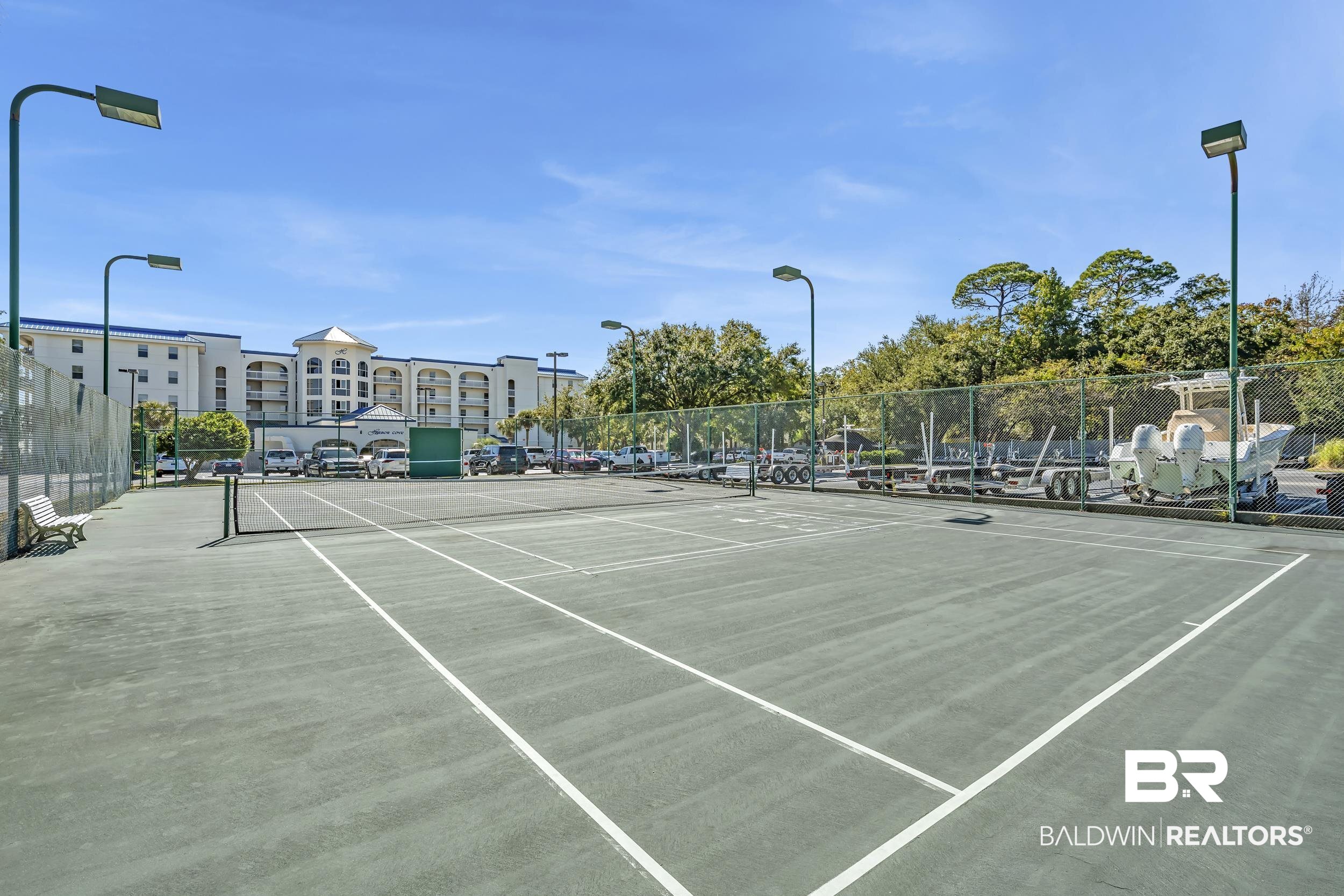 27282 Canal Road, Unit 104 Orange Beach, AL 36561 - Photo 65 of 79 View of tennis court with community basketball court