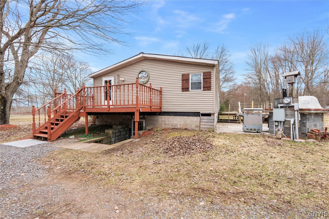 75 Ridge Road Granby, NY 13126 - Photo 34 of 50 Side view showing walk out basement