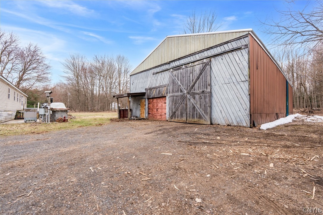 75 Ridge Road Granby, NY 13126 - Photo 37 of 50 Pole barn with new roof, overhead door and sliding