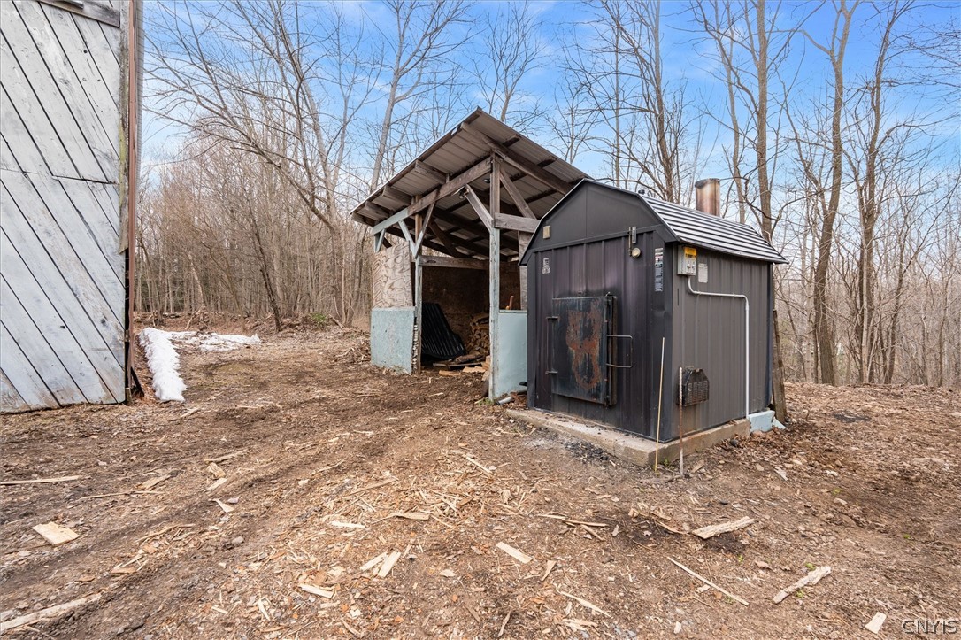 75 Ridge Road Granby, NY 13126 - Photo 38 of 50 Wood boiler and wood shed