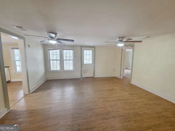 a view of an empty room with a window