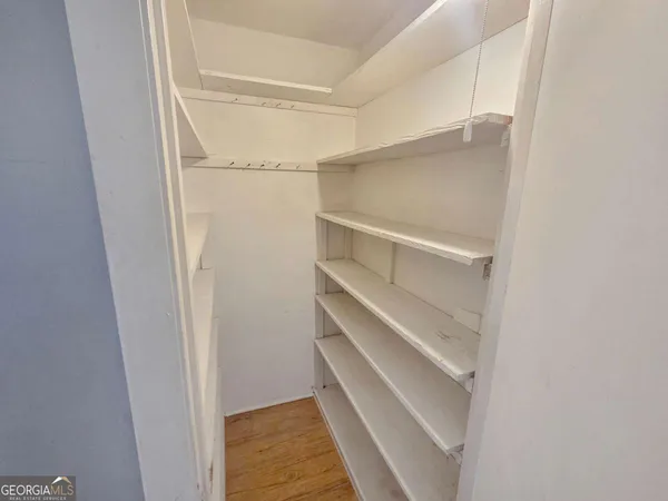 a view of an empty walk in closet