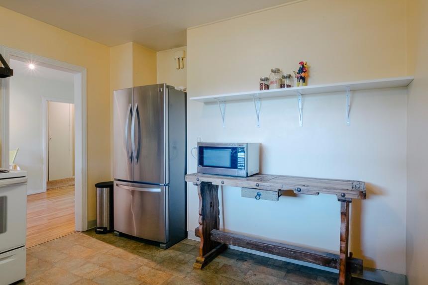1008 Reddy Avenue Medford, OR 97504 - Photo 14 of 32 a view of a kitchen with fridge and wooden floor