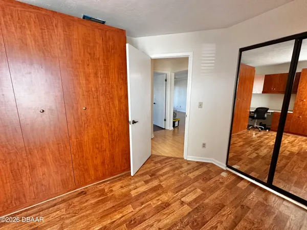 a view of a bedroom from a hallway