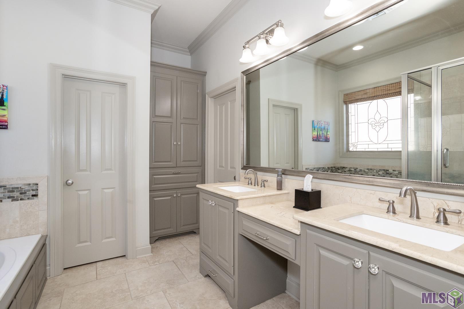13240 Quail Grove Avenue Baton Rouge, LA 70809 - Photo 13 of 26 Double Vanities Plus Great Cabinet Storage and a Walk In Closet in the Master Bath