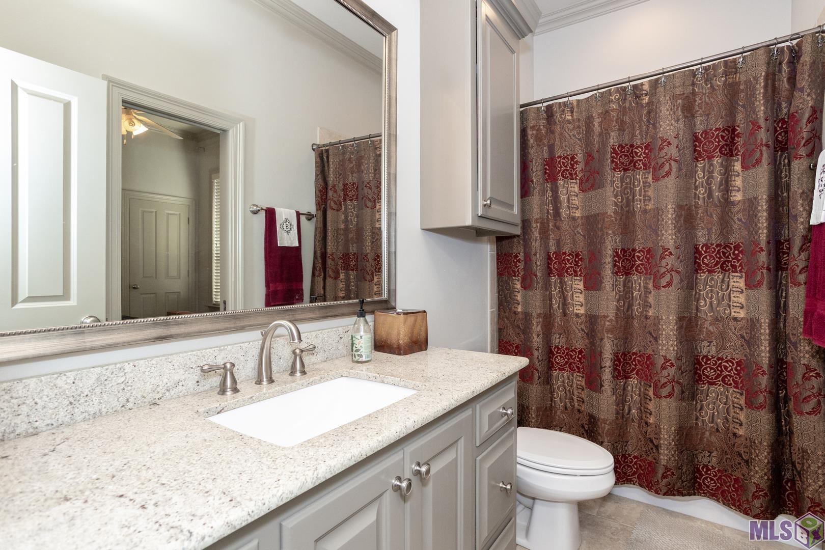 13240 Quail Grove Avenue Baton Rouge, LA 70809 - Photo 19 of 26 Third FULL bathroom with Access from BR 4 and it is Convenient to the Garage/Laundry or Kitchen