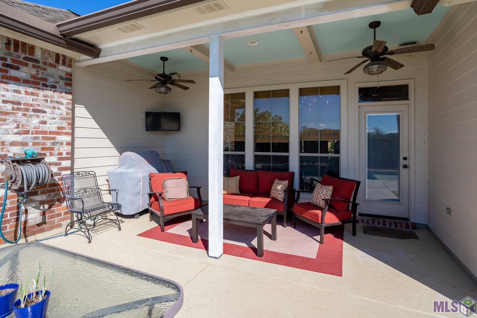 13240 Quail Grove Avenue Baton Rouge, LA 70809 - Photo 24 of 26 Cozy Covered Area Overlooking the Pool and Yard