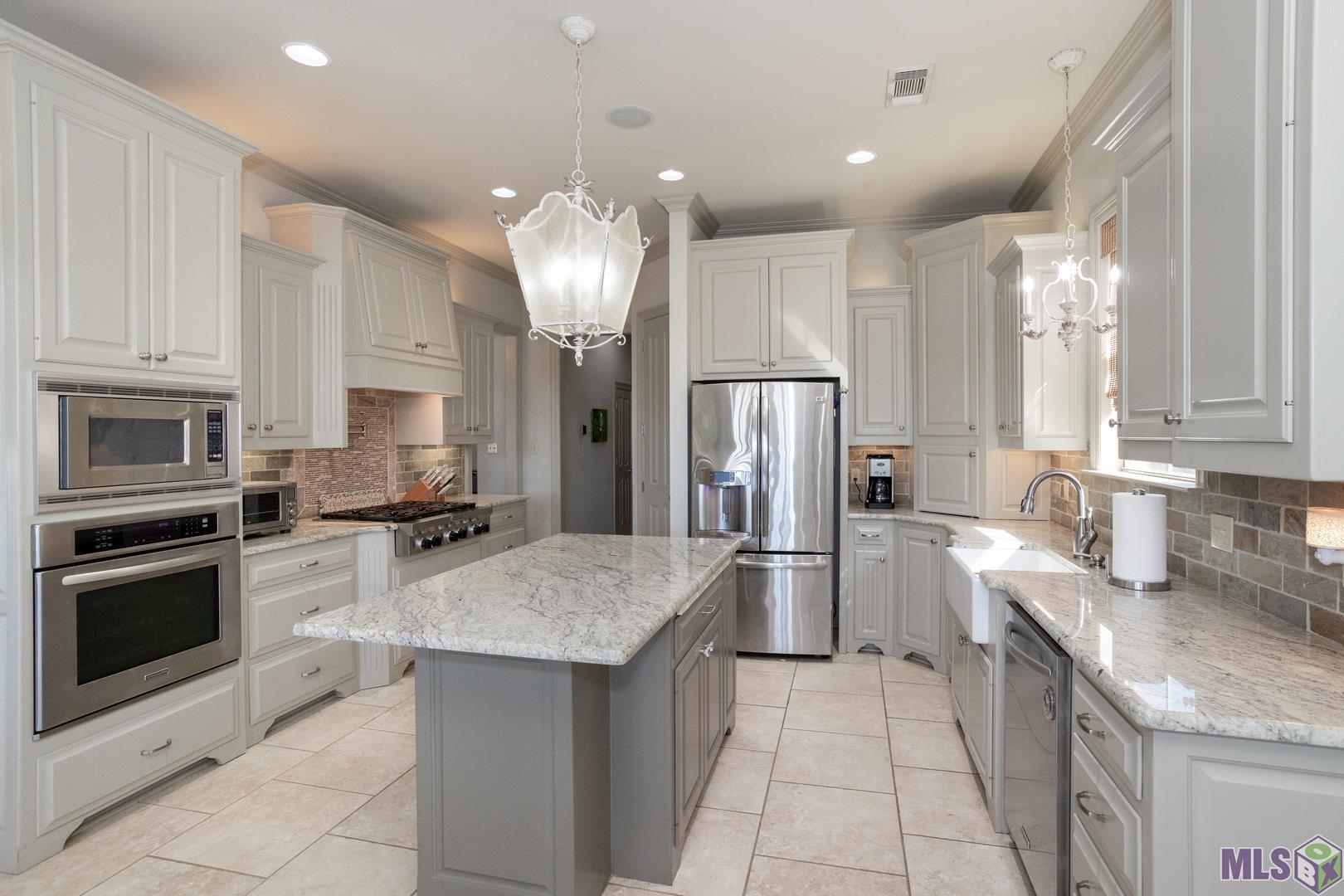 13240 Quail Grove Avenue Baton Rouge, LA 70809 - Photo 8 of 26 Granite Counters Stainless Appliances including a Pot Filler over the Gas Stove