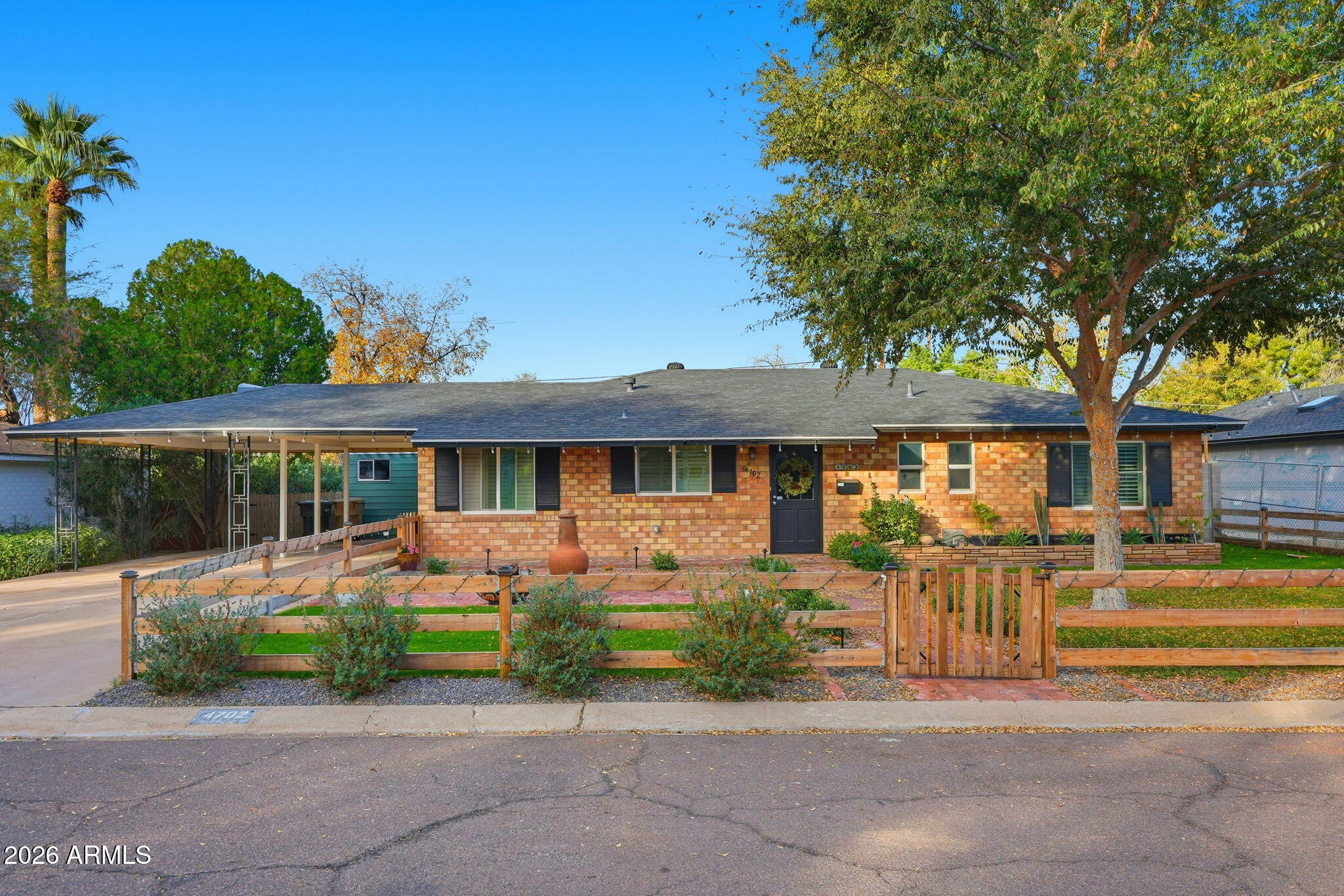 4702 North 30th Place Phoenix, AZ 85016 - Photo 1 of 34 front view of a house with a yard