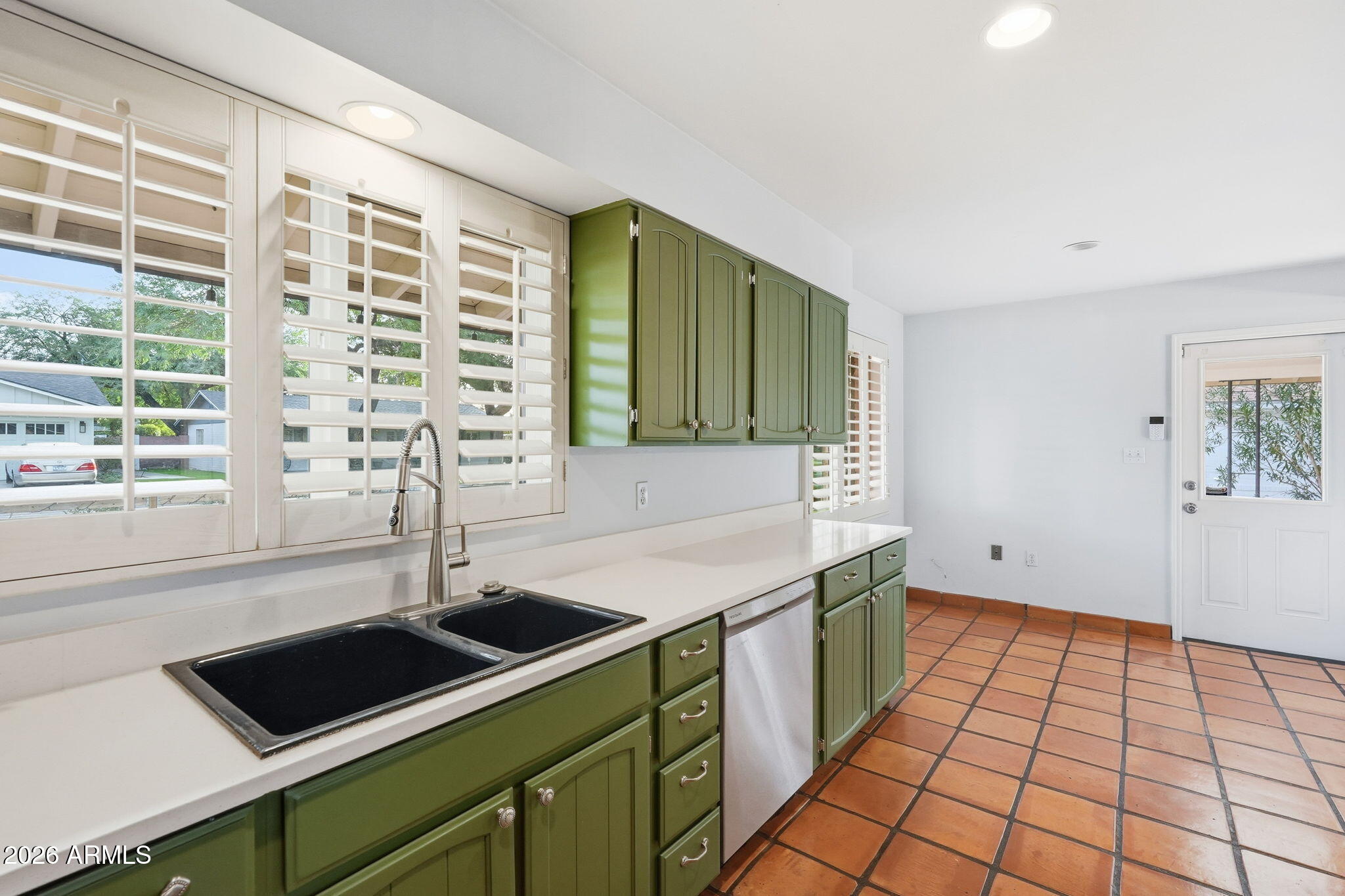 4702 North 30th Place Phoenix, AZ 85016 - Photo 11 of 34 a kitchen with a sink and a window