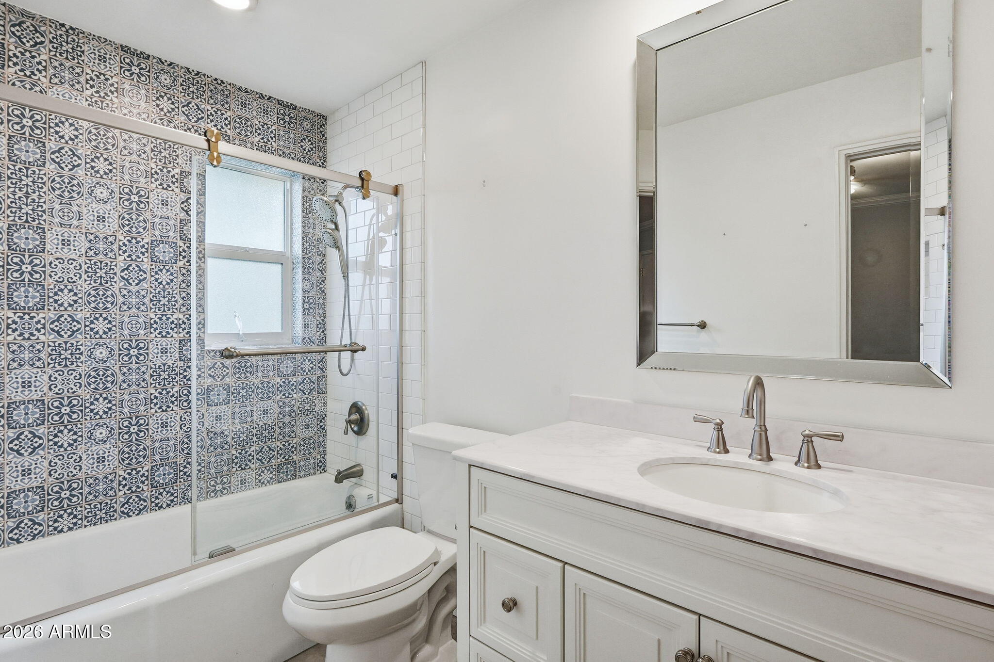 4702 North 30th Place Phoenix, AZ 85016 - Photo 27 of 34 a bathroom with a granite countertop sink toilet and shower