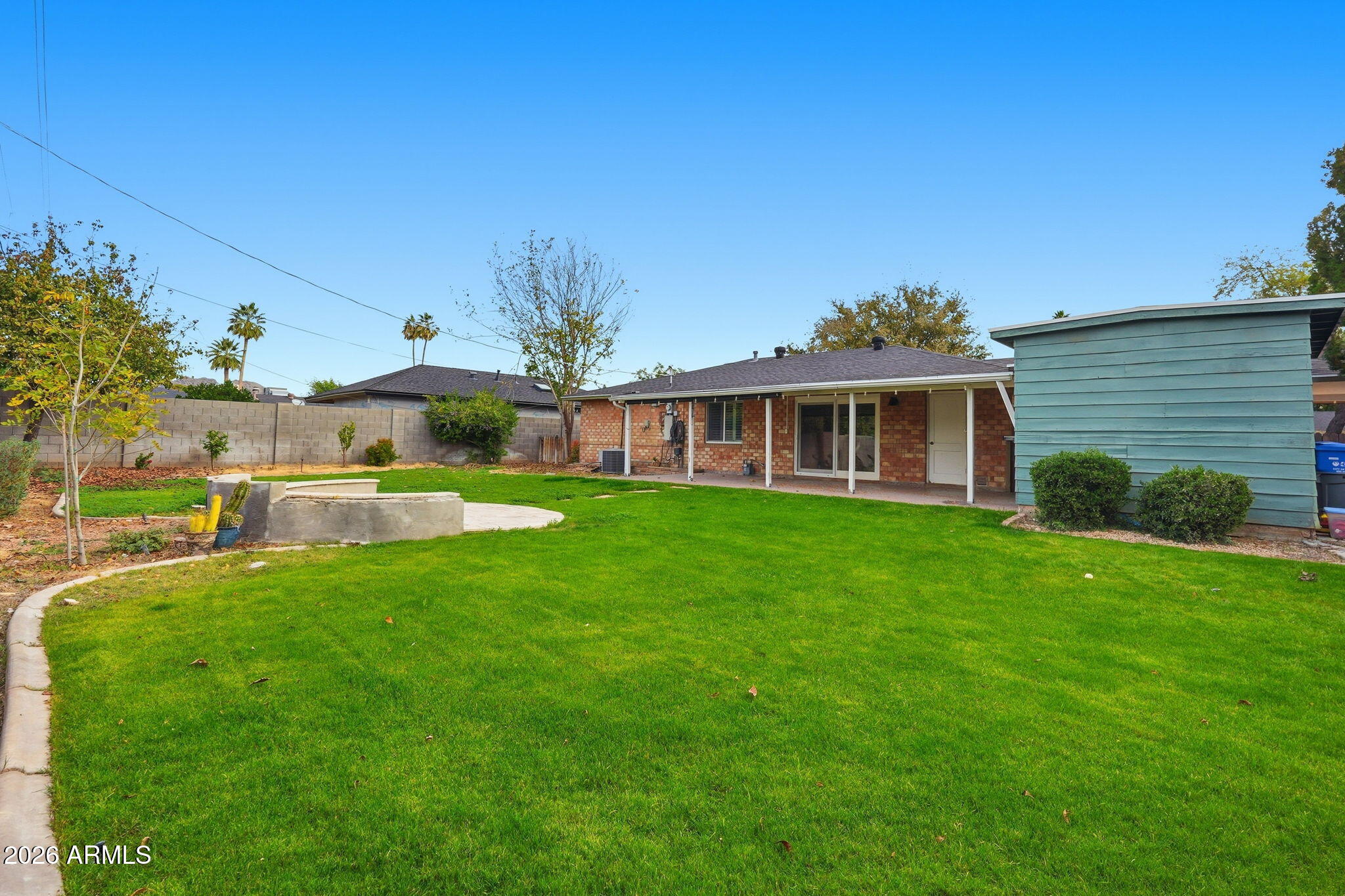4702 North 30th Place Phoenix, AZ 85016 - Photo 33 of 34 a front view of a house with a yard