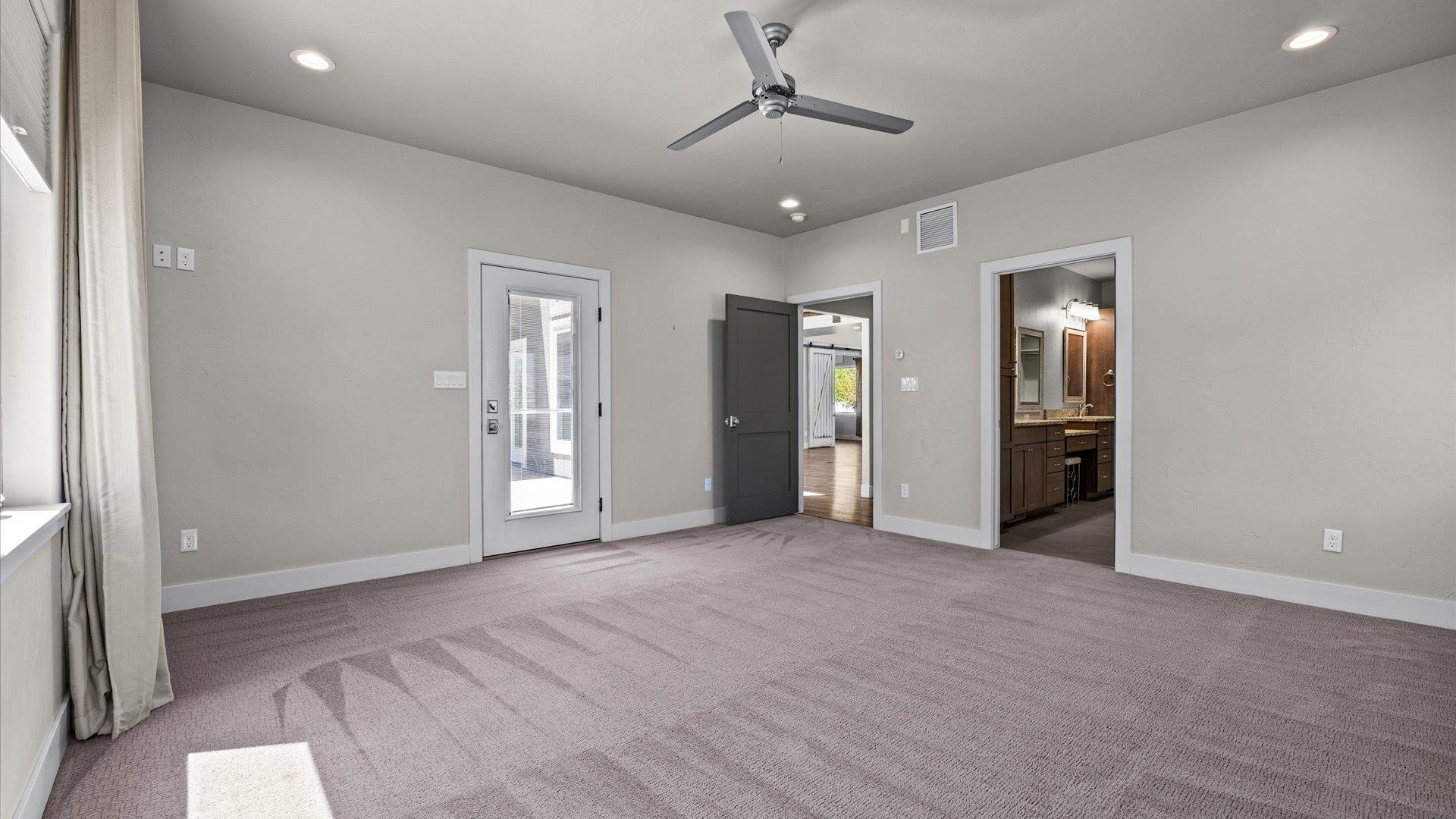 2041 J J 1/2 Road Fruita, CO 81521 - Photo 15 of 42 an empty room with closet and windows