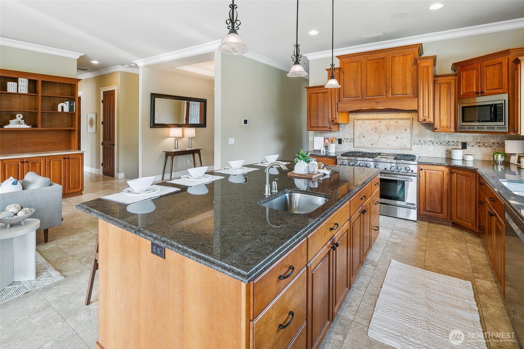 3505 Newberg Road Snohomish, WA 98290 - Photo 7 of 40 a kitchen with stainless steel appliances granite countertop a sink a stove and a wooden cabinets