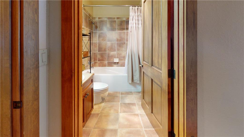 161 Hawk Circle, Unit 2336 Keystone, CO 80435 - Photo 12 of 29 a bathroom with a tub and shower