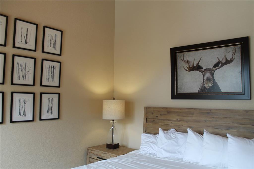 161 Hawk Circle, Unit 2336 Keystone, CO 80435 - Photo 18 of 29 a bedroom with a bed and painting on the wall