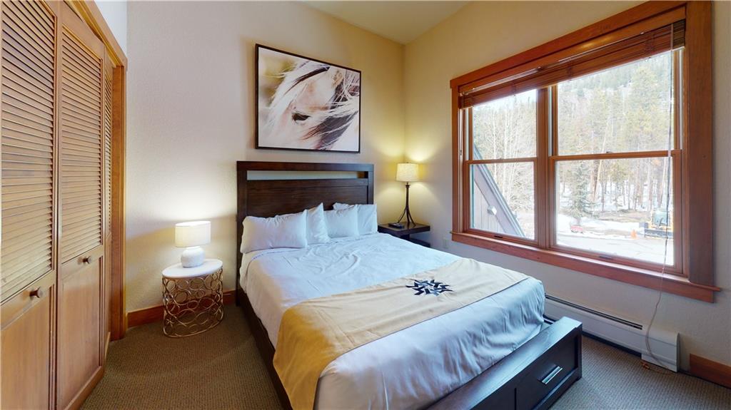 161 Hawk Circle, Unit 2336 Keystone, CO 80435 - Photo 20 of 29 a bedroom with a bed and a window