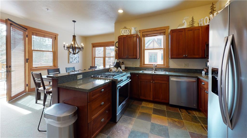 161 Hawk Circle, Unit 2336 Keystone, CO 80435 - Photo 6 of 29 a kitchen with a sink stove and refrigerator