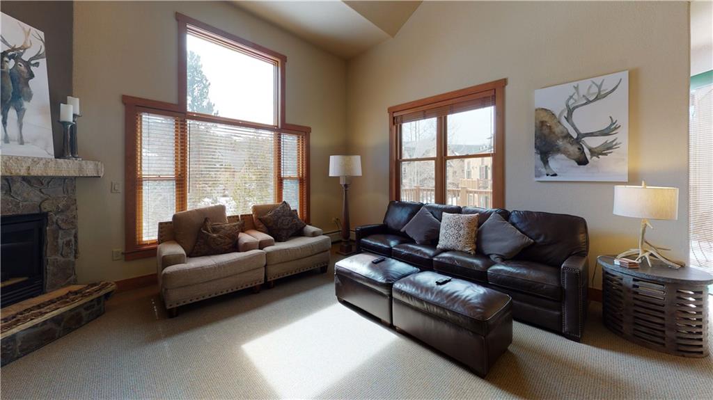161 Hawk Circle, Unit 2336 Keystone, CO 80435 - Photo 7 of 29 a living room with furniture and a fireplace